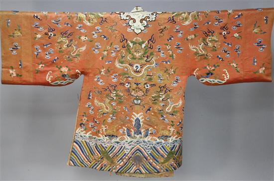 A Chinese apricot satin embroidered silk and metal thread dragon robe, late 19th century,